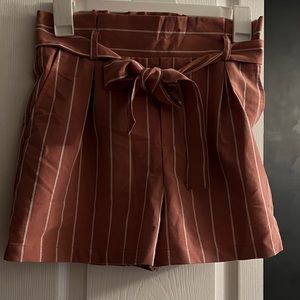 pink shorts with white stripes